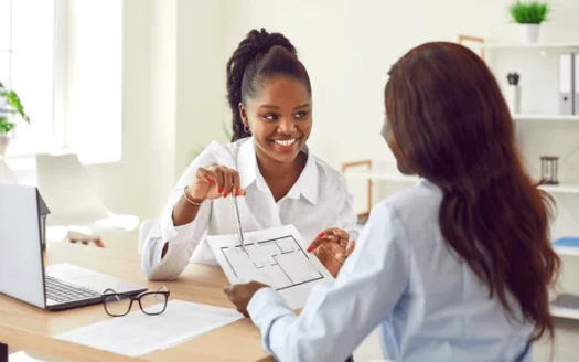 Splendor Holdings team assisting a client or showing property plans.